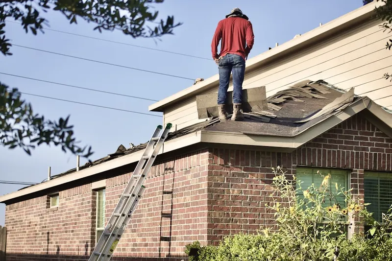 Professional roofer working on a residential roof in Shadow Lake Estates
